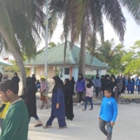 People walking near a harbor area