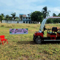 a red golf cart parked on a field