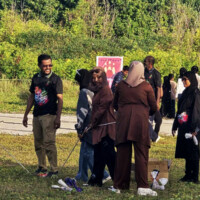 young girls playing tug of war at a field