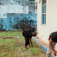 physically challenged man bending to clean
