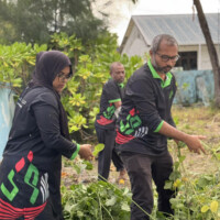 handsome man helping distressed woman pull vines