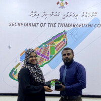 Confused man giving a clothe to a woman