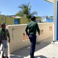 Man walking towards a door