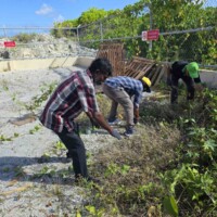 Thimarafushi council team cleaning waste management center