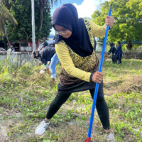 woman dancing with a broom stick