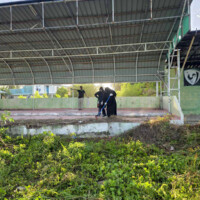 People on top of a rostrum cleaning