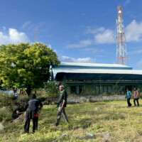 People walking on a grass field