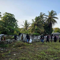 people gathered at a grass field