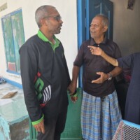 Maldives Thimarafushi MCEP survey team meeting old man for discussion